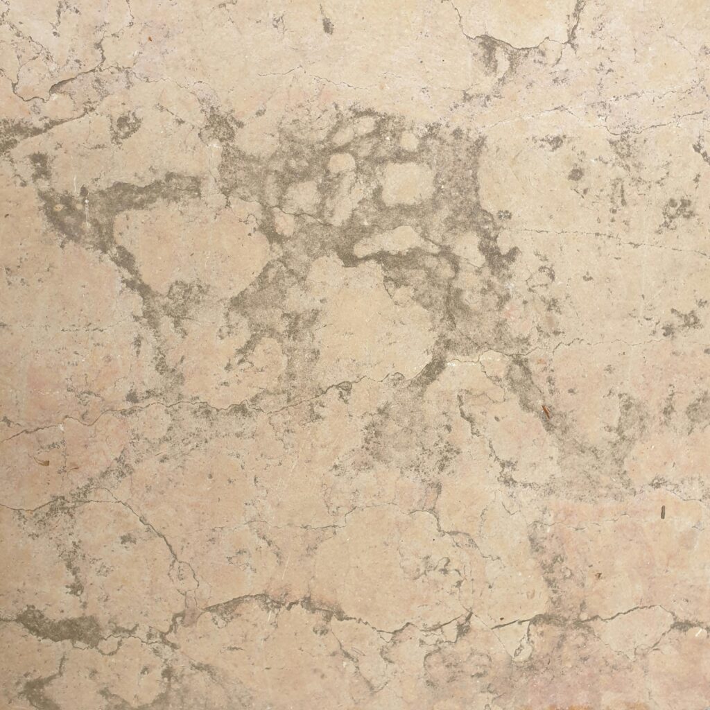 Close-up view of a natural stone surface showcasing its unique texture and patterns.
