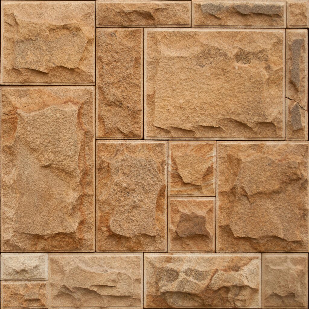Rough stone wall featuring geometric patterns and earthy tones for architectural design.